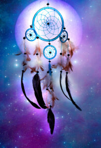 Dreamcatcher against a moon and purple/blue background