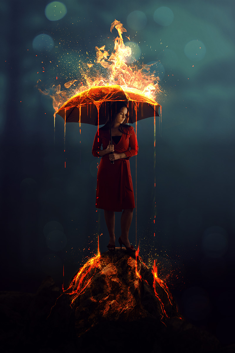 A woman with a burning umbrella in a dark forest